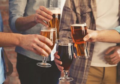 men toasting with beer